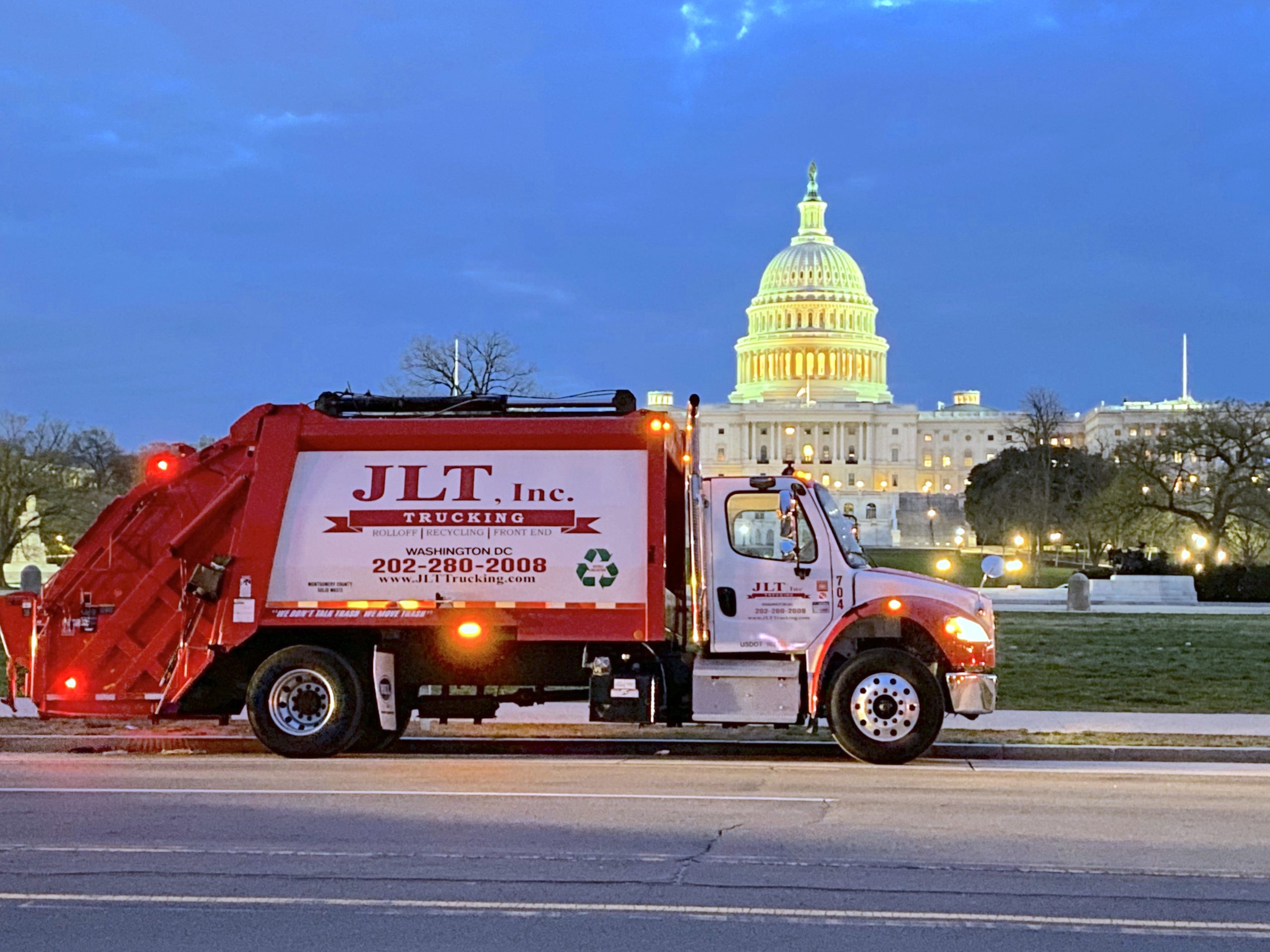 link for waste services; Rear load truck in front of the capital